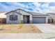 Charming single-story home featuring a two car garage and low maintenance desert landscaping at 17463 N 66Th Ave, Glendale, AZ 85308