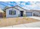 Charming single-story home featuring a two car garage and low maintenance desert landscaping at 17463 N 66Th Ave, Glendale, AZ 85308