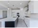 Modern kitchen boasts white cabinets, stainless steel appliances, and a contrasting island at 17463 N 66Th Ave, Glendale, AZ 85308