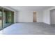 Bright, open living room featuring neutral paint and gray tile flooring at 17463 N 66Th Ave, Glendale, AZ 85308