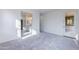 Spacious primary bedroom with plush carpeting, leading to an ensuite bathroom at 17463 N 66Th Ave, Glendale, AZ 85308