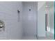 An elegant shower with gray subway tile and built-in niche with frameless glass at 17463 N 66Th Ave, Glendale, AZ 85308