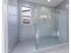 New gray subway tile shower with glass door and built-in niche at 17463 N 66Th Ave, Glendale, AZ 85308
