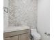 Elegant powder room with stylish chevron tile accent wall and modern fixtures at 12297 E Troon Vista Dr # 255, Scottsdale, AZ 85255