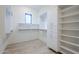 Bright walk-in closet with custom storage solutions and open shelving at 12297 E Troon Vista Dr # 255, Scottsdale, AZ 85255