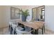 Dining room featuring modern decor, light wood floors, and black framed mirror at 12297 E Troon Vista E Dr, Scottsdale, AZ 85255