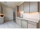 Modern kitchen area featuring stainless steel appliances, sleek fixtures, and tiled backsplash at 12297 E Troon Vista Dr # 255, Scottsdale, AZ 85255