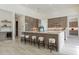Spacious kitchen featuring a large island with seating, pendant lighting and stainless steel appliances at 12297 E Troon Vista Dr # 255, Scottsdale, AZ 85255