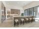 Modern kitchen features an island with seating, stainless steel appliances, and sleek cabinetry at 12297 E Troon Vista Dr # 255, Scottsdale, AZ 85255
