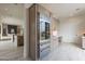 Spacious kitchen with light wood cabinets, stainless steel appliances, and an island at 12297 E Troon Vista Dr # 255, Scottsdale, AZ 85255