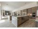 Open-concept kitchen boasts a large island, modern appliances, and seamless flow into the living space at 12297 E Troon Vista Dr # 255, Scottsdale, AZ 85255