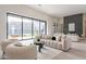 Modern living room with a sleek fireplace, expansive windows, and mountain views at 12297 E Troon Vista Dr # 255, Scottsdale, AZ 85255