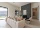 A modern living room boasts a cozy, textured sofa and a sleek stone fireplace at 12297 E Troon Vista Dr # 255, Scottsdale, AZ 85255