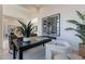 Bright office features a dark wood desk, contemporary art, and ample natural light at 12297 E Troon Vista Dr # 255, Scottsdale, AZ 85255