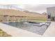 A serene pool featuring modern water features set against a scenic mountain backdrop at 12297 E Troon Vista Dr # 255, Scottsdale, AZ 85255