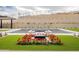A luxurious pool with fountains is surrounded by red flowers and greenery at 12297 E Troon Vista Dr # 255, Scottsdale, AZ 85255