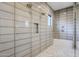 Contemporary shower featuring dual showerheads, gray tiles, and a glass enclosure at 12297 E Troon Vista Dr # 255, Scottsdale, AZ 85255