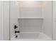 Clean and white bathroom with tiled walls and shower-tub combo at 18450 E Camila Dr, Gold Canyon, AZ 85118