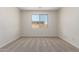 Spacious bedroom featuring plush carpeting, ample natural light, and a calming atmosphere at 18450 E Camila Dr, Gold Canyon, AZ 85118