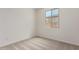 Neutral bedroom features carpeted floors and a window letting in natural light at 18450 E Camila Dr, Gold Canyon, AZ 85118