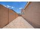 Spacious side yard with a block fence and potential for customization under a bright sky at 18450 E Camila Dr, Gold Canyon, AZ 85118