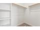 Walk-in closet with carpeted flooring and white shelving offering ample storage space at 18450 E Camila Dr, Gold Canyon, AZ 85118