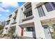 Modern townhome exterior with red door and landscaping at 312 E Windsor Ave # 14, Phoenix, AZ 85004