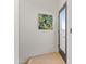 Hallway featuring light colored wood floors and access to a room with a glass door at 312 E Windsor Ave # 14, Phoenix, AZ 85004