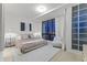 Modern main bedroom with night cityscape view, minimalist design and large window at 312 E Windsor Ave # 14, Phoenix, AZ 85004