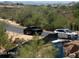 Neighborhood street view showcasing local desert vegetation and a distant mountain range at 37445 N 104Th Pl, Scottsdale, AZ 85262