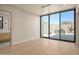 Bedroom with glass doors opening to a backyard patio with grill at 28119 N 109Th Way, Scottsdale, AZ 85262