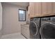 Laundry room with modern washer and dryer at 28119 N 109Th Way, Scottsdale, AZ 85262