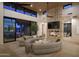 Open living space with curved sofa and views of patio at 28119 N 109Th Way, Scottsdale, AZ 85262