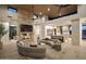 Open concept living room with large sectional sofa and fireplace at 28119 N 109Th Way, Scottsdale, AZ 85262