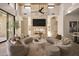 Spacious living room with a modern fireplace and seating at 28119 N 109Th Way, Scottsdale, AZ 85262