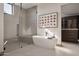 Luxurious bathroom with soaking tub and walk-in shower at 28101 N 109Th Way, Scottsdale, AZ 85262
