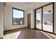 Bright bedroom with wood floors and sliding glass doors leading to a patio at 28101 N 109Th Way, Scottsdale, AZ 85262