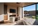 Main bedroom with private patio access and fireplace at 28101 N 109Th Way, Scottsdale, AZ 85262