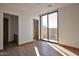 Spacious bedroom featuring wood floors and sliding glass doors at 28101 N 109Th Way, Scottsdale, AZ 85262