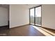 Bright bedroom with wood floors and sliding glass doors to patio at 28101 N 109Th Way, Scottsdale, AZ 85262