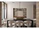 Elegant dining room with built-in wine storage and modern chandelier at 28101 N 109Th Way, Scottsdale, AZ 85262