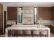 Gourmet kitchen featuring island seating, contemporary cabinetry, and pendant lighting at 28101 N 109Th Way, Scottsdale, AZ 85262