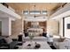 Open-concept living area with high ceilings, a modern fireplace, and kitchen views at 28101 N 109Th Way, Scottsdale, AZ 85262