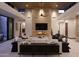Elegant living room featuring a large sectional sofa and stone fireplace at 28101 N 109Th Way, Scottsdale, AZ 85262