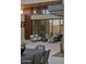 Outdoor patio with seating area, dining table, and views of the home's interior at 28101 N 109Th Way, Scottsdale, AZ 85262
