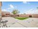Spacious backyard featuring a large patio area, minimal landscaping and potential for custom design at 9143 W Harmony Ln, Peoria, AZ 85382