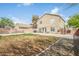 Spacious backyard with patio, ideal for outdoor gatherings and relaxation on a sunny day at 9143 W Harmony Ln, Peoria, AZ 85382