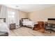 Cozy bedroom with two beds, soft lighting, and neutral decor at 9143 W Harmony Ln, Peoria, AZ 85382