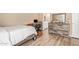 Bedroom featuring a desk and a rustic wood dresser at 9143 W Harmony Ln, Peoria, AZ 85382