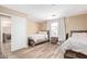 Bedroom with two beds, neutral walls and laminate flooring at 9143 W Harmony Ln, Peoria, AZ 85382